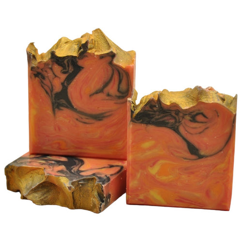 orange red soap with black gold top sculpted top seife