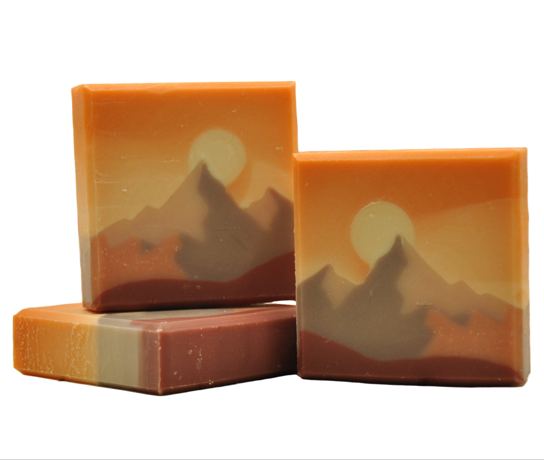 Three soap bars with mountain everest designs on a white background