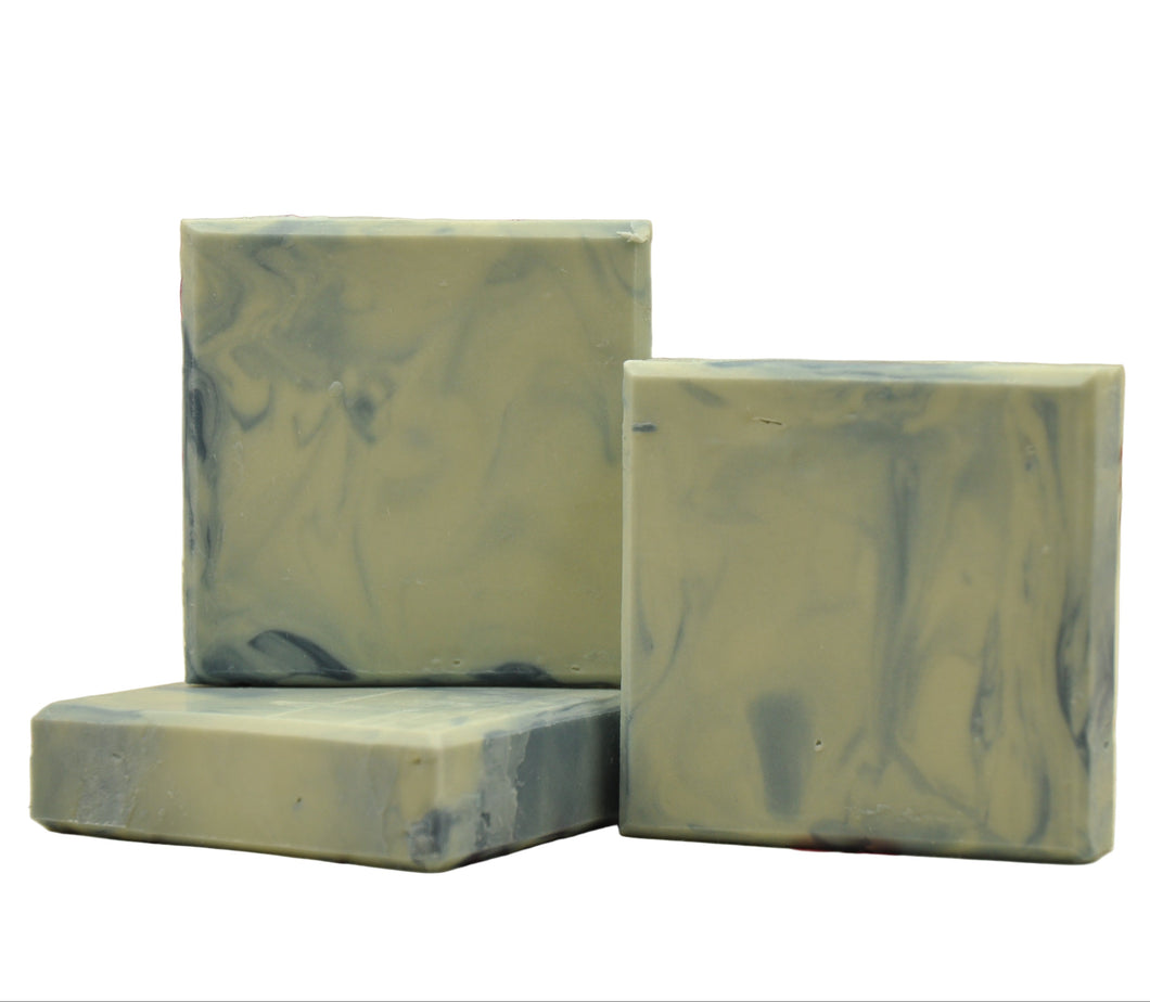 Three bars of soap with a blue white marbled pattern on a white background