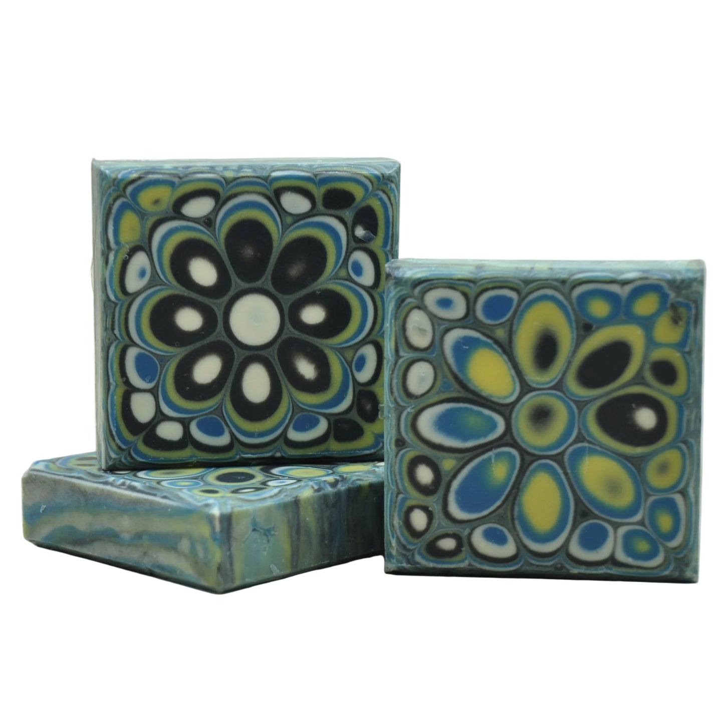 Handmade cold process goat milk soap with a dramatic kaleidoscope mandala in black, white, teal, and gold – Kaleidoscope Midnight natural artisan soap, unique bar