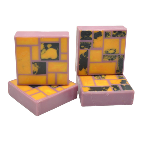 Piet Mondrian inspired soap orange blocks on violet background with black spots seife