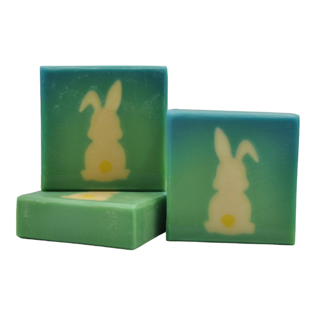 White bunny yellow tail on green background soap Hase seife